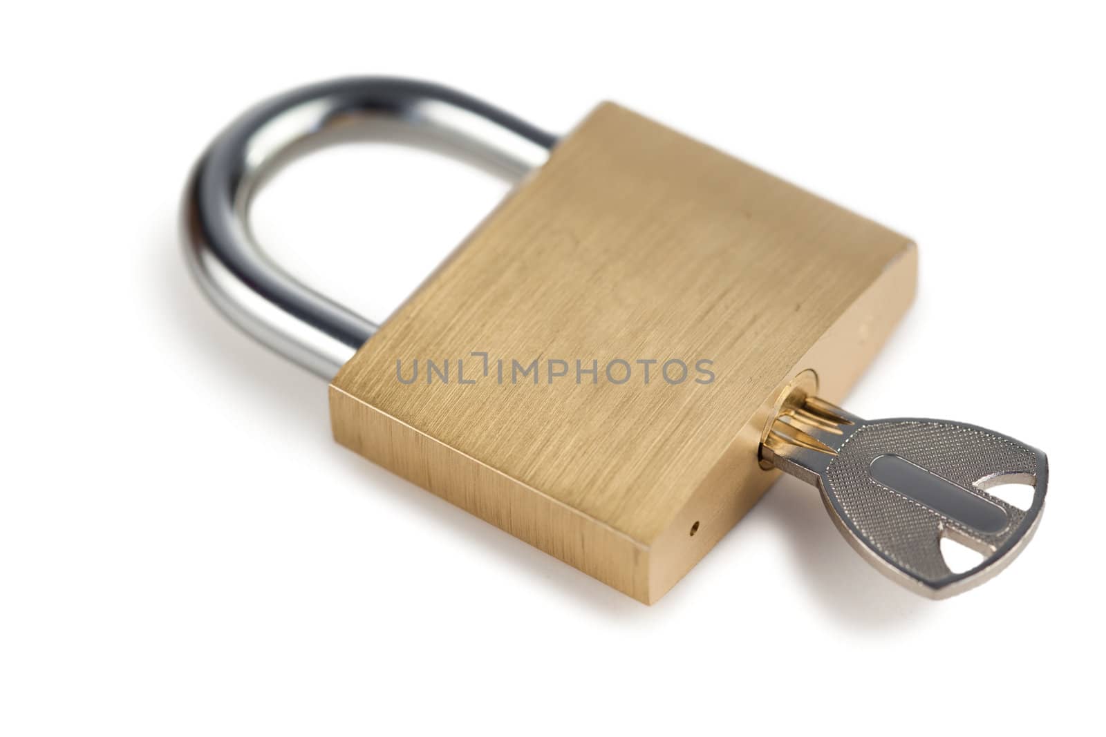 Close golden padlock on a white background