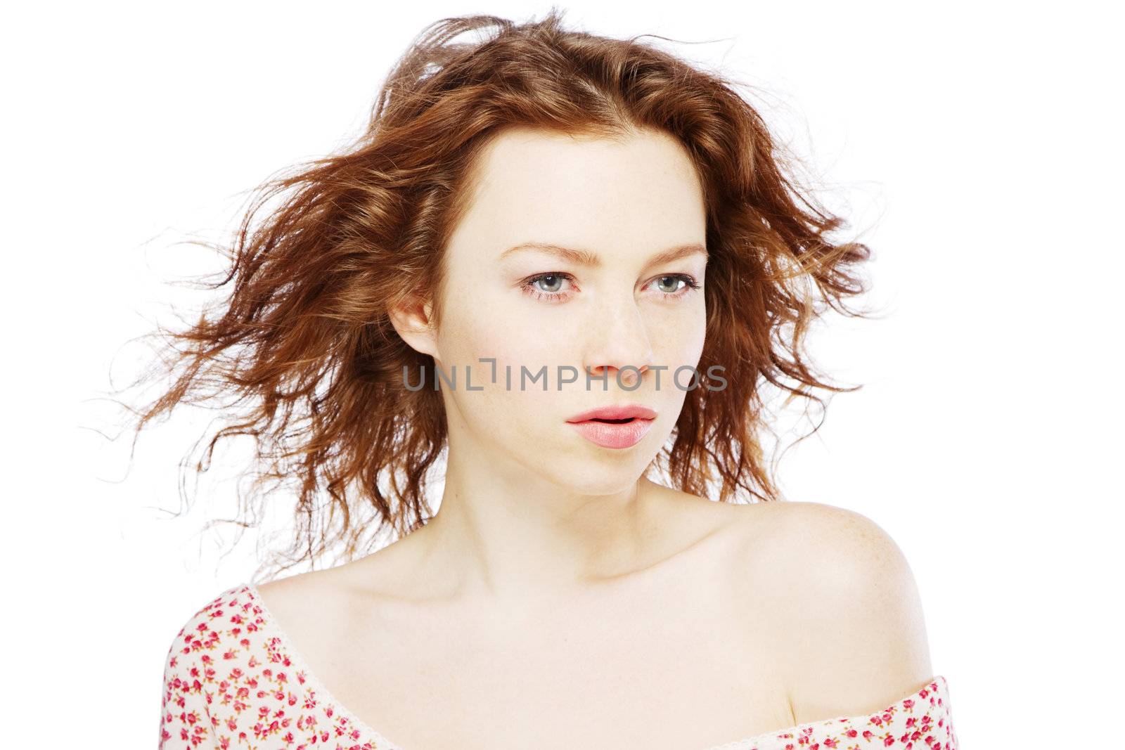 Beautiful red-haired model isolated on white background