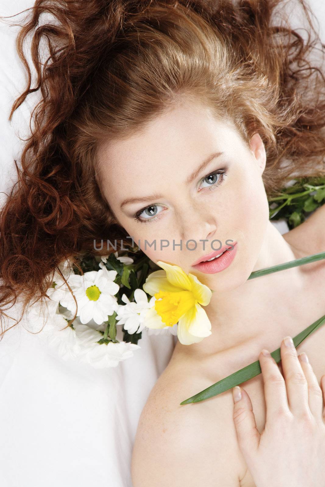 Face portrait of a beautiful model with flowers