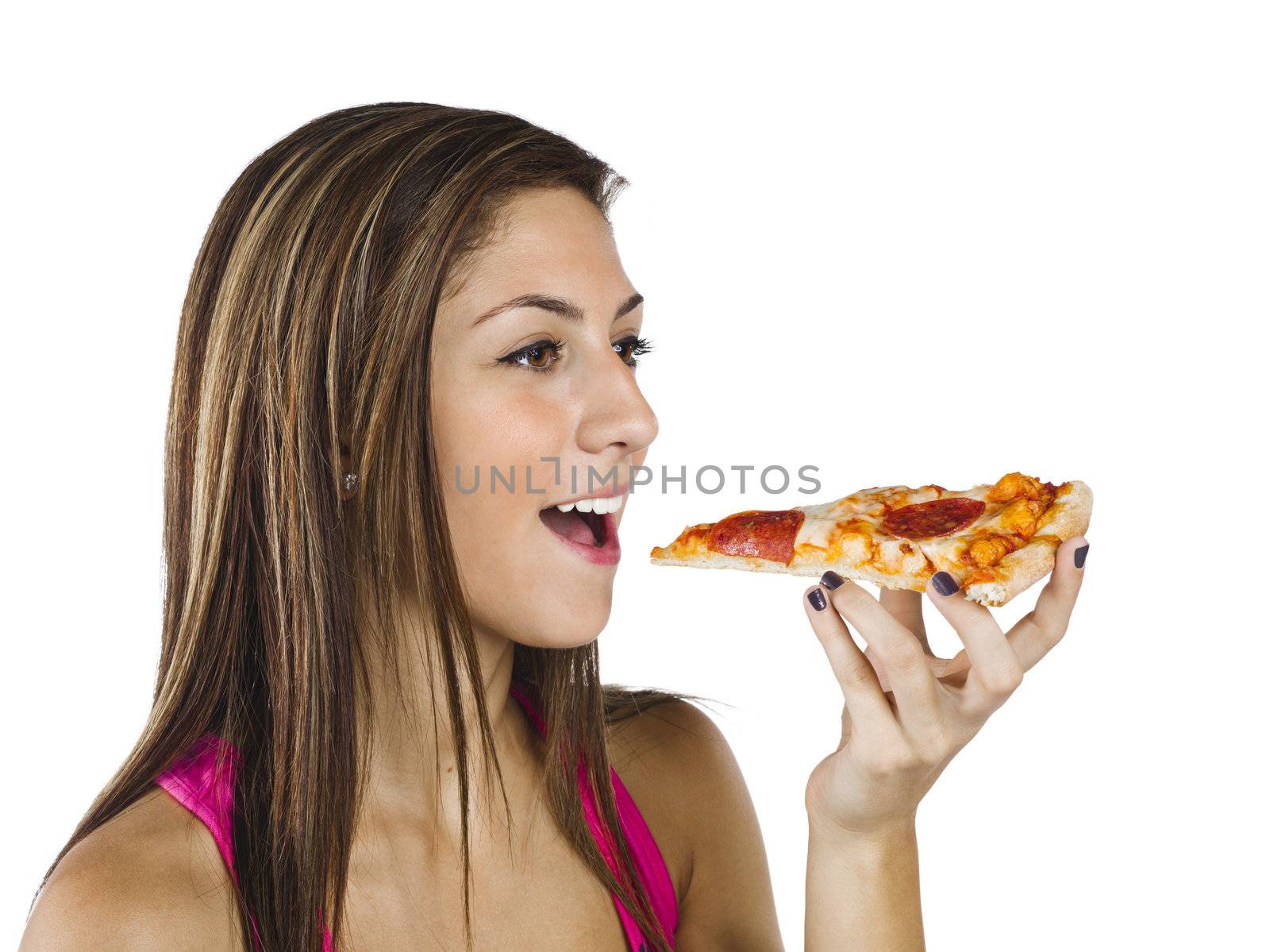 Close-up of a teenage girl eating pizza against white background.