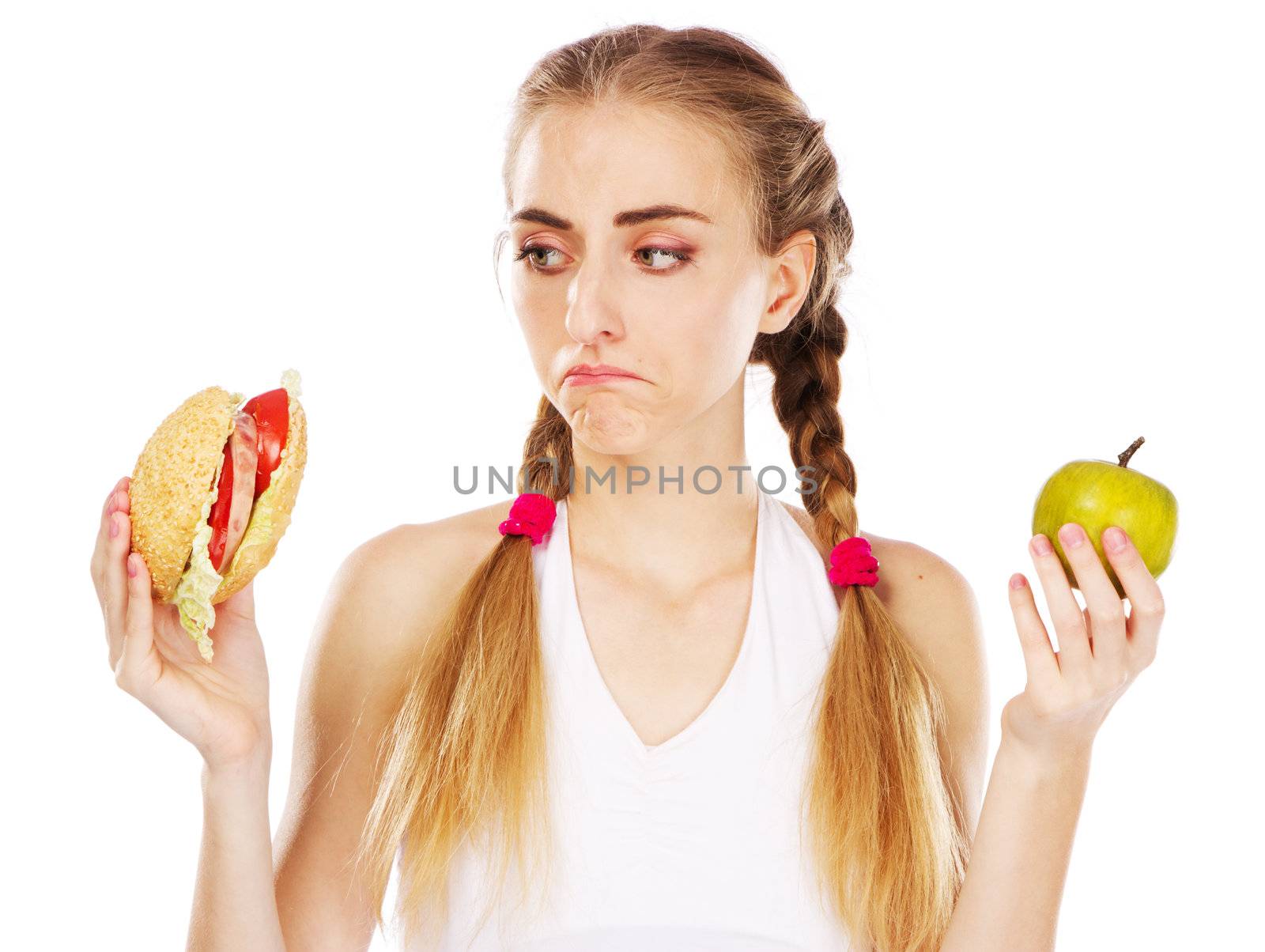 Young woman choosing between hamburger and apple by Gdolgikh