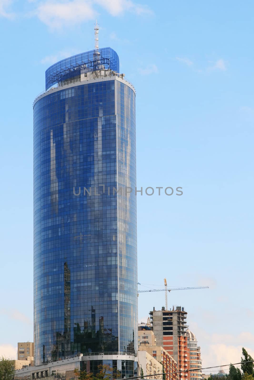 Tall blue office building in a city center