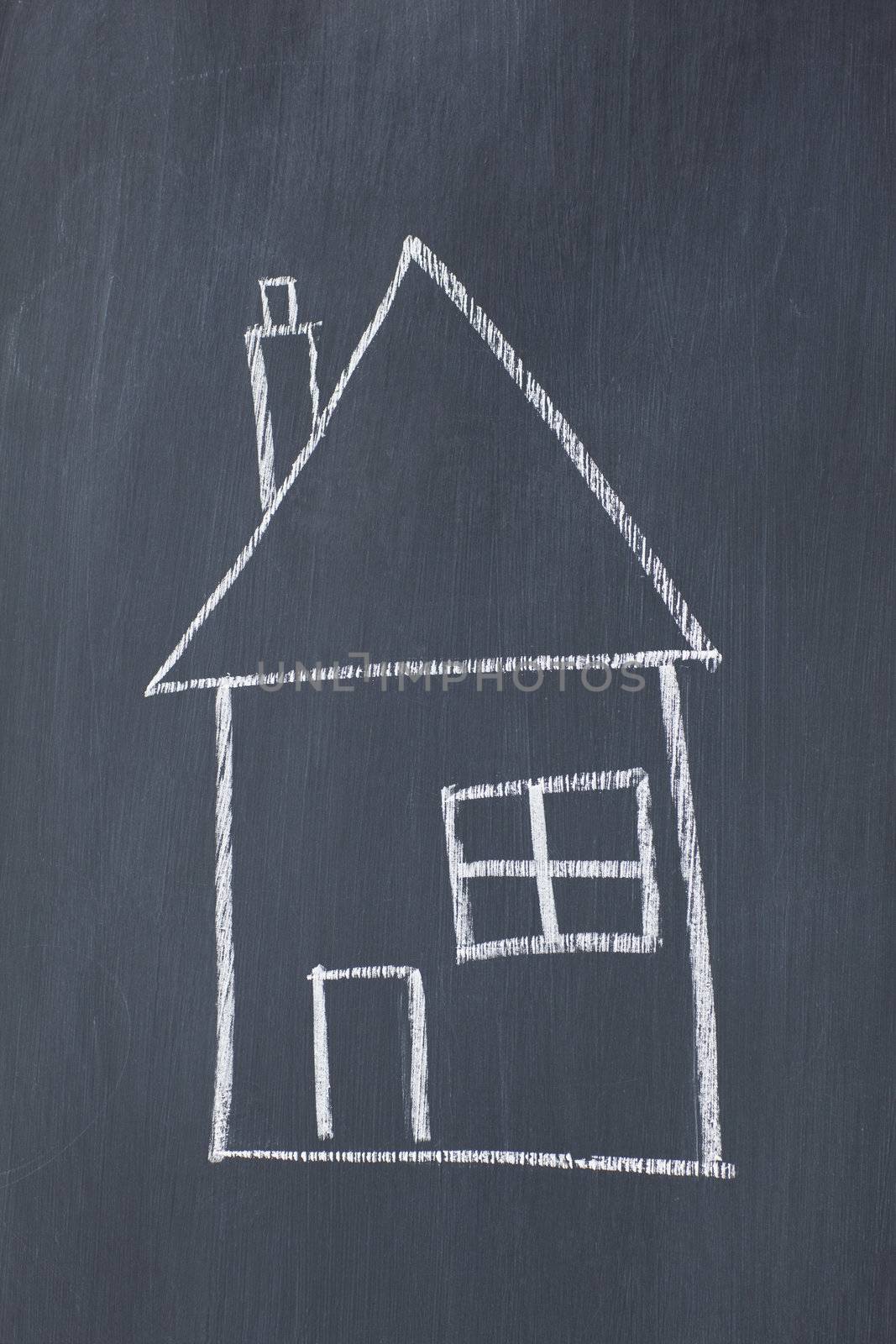 Simple house on a blackboard