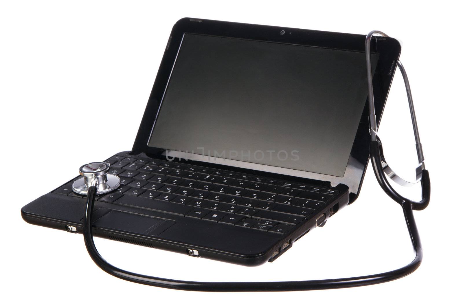 Modern netbook with a stethoscope over it, for computer service concept