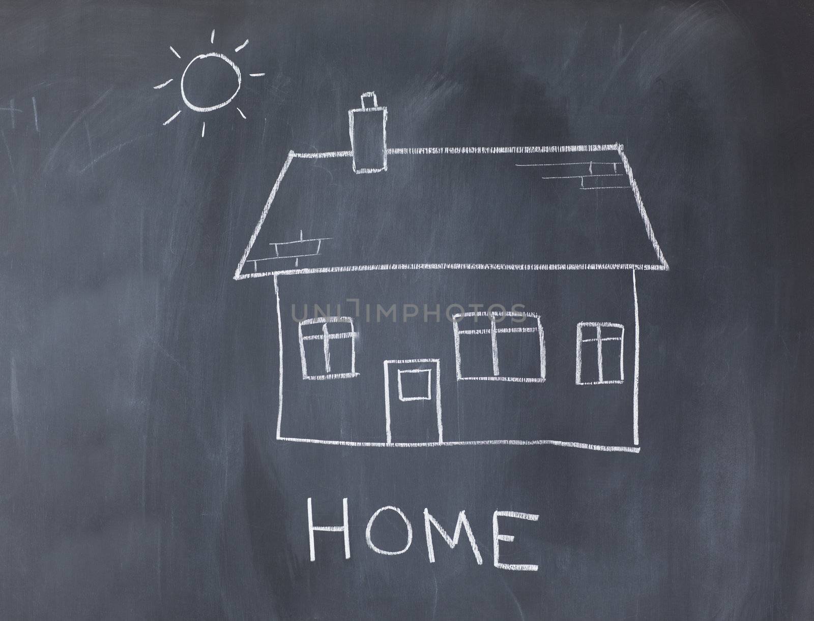 Big house and sun on a blackboard