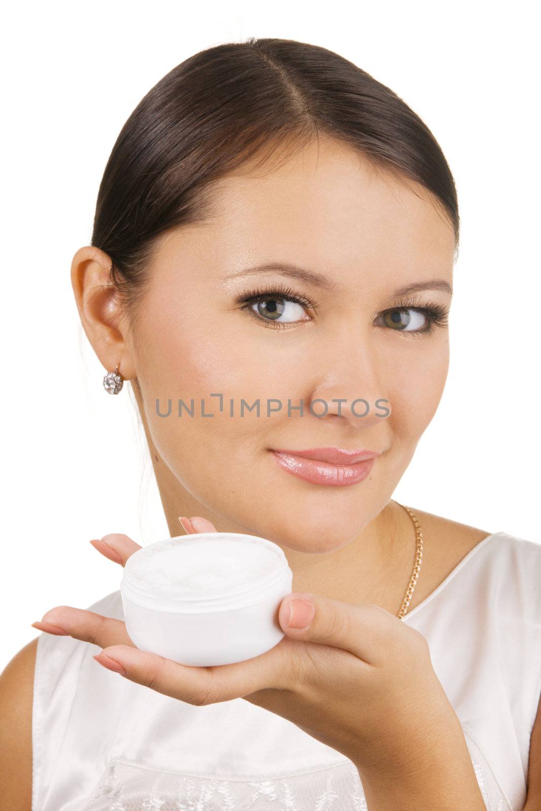 Young beautiful woman applying skin cream by Gdolgikh