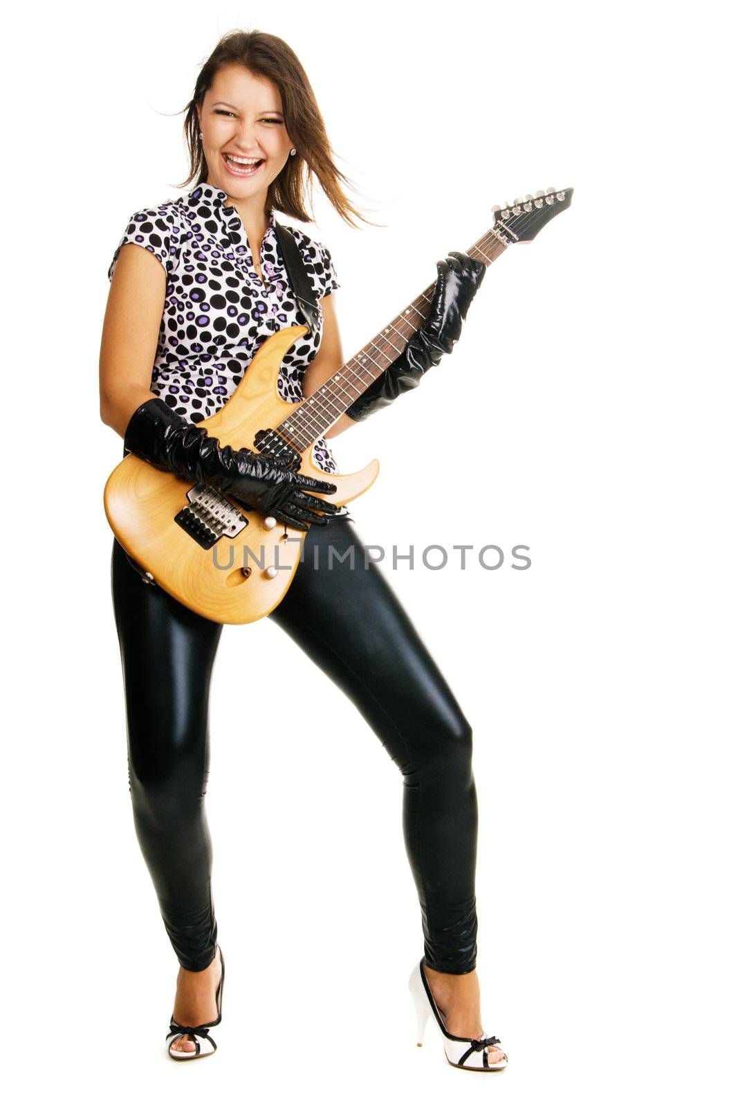 Attractive lady expressively playing an electric guitar