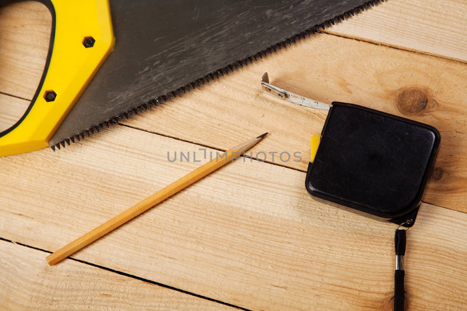 Carpenter's tools on pine desks by Gdolgikh