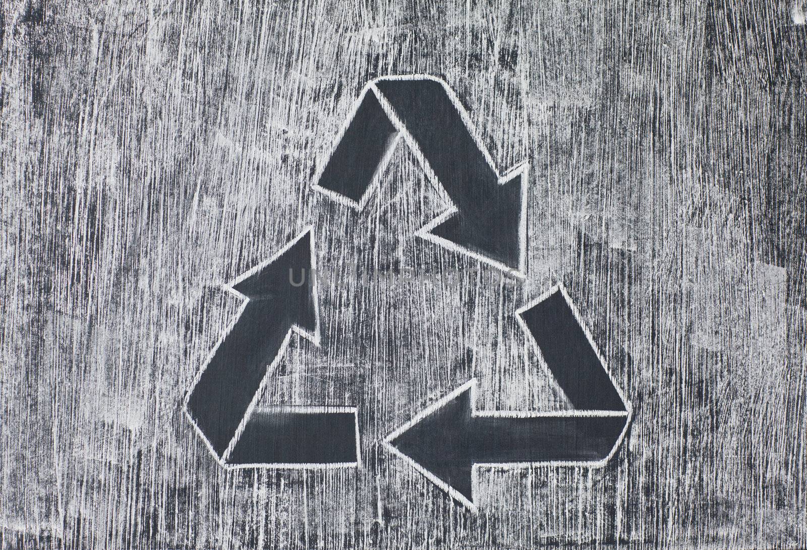 Recycle symbol on a white chalky background