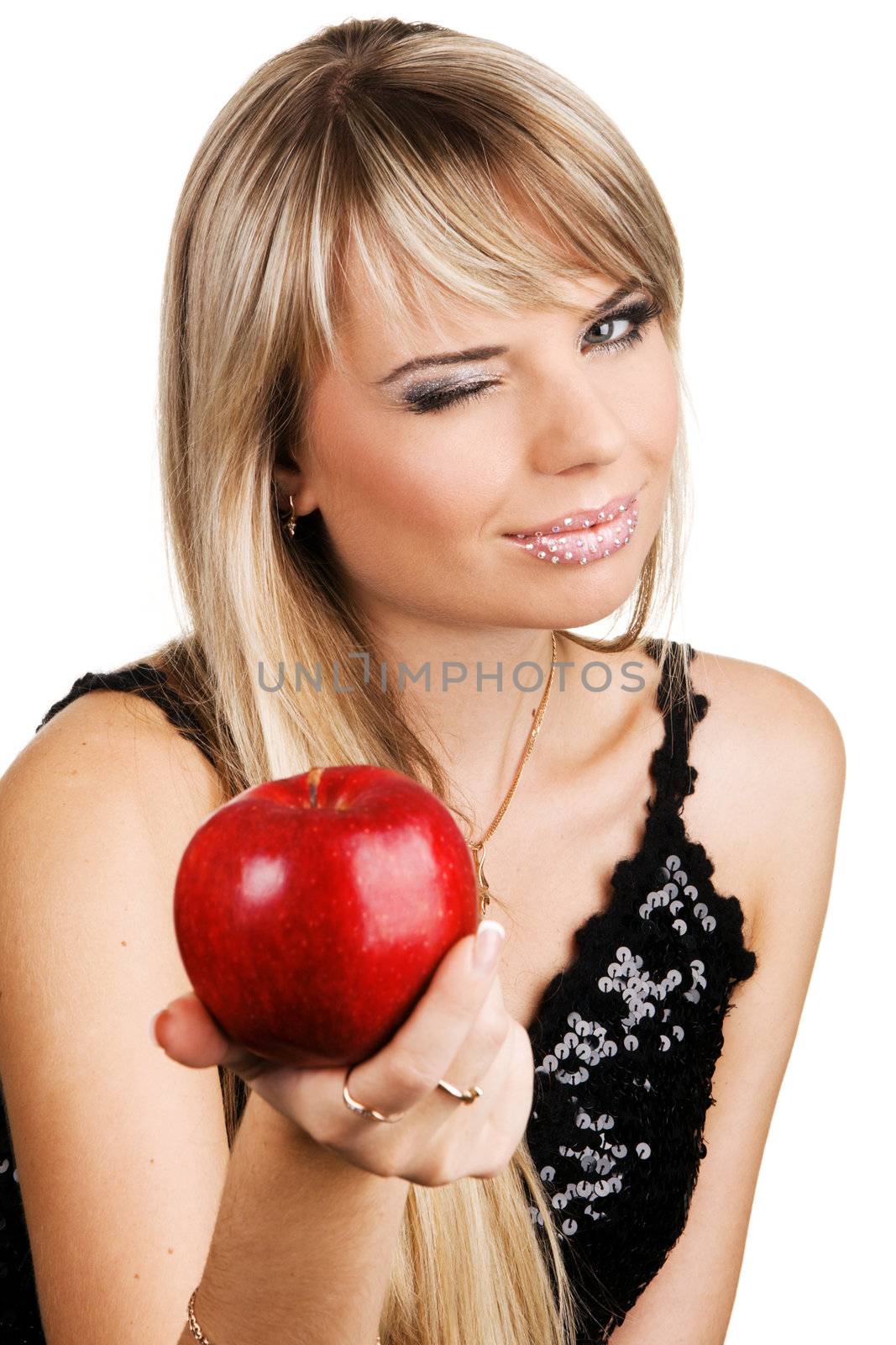 Beautiful young woman proposing a fresh red apple