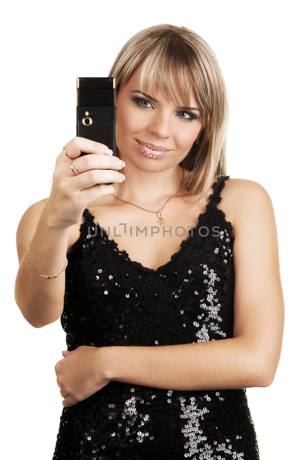 Beautiful yong woman in black evening gown, holding a mobile phone