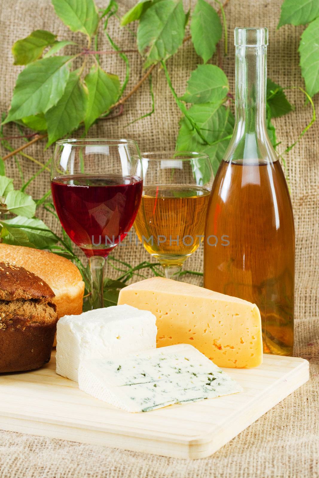 Wine and grapes on vintage background, studio photo