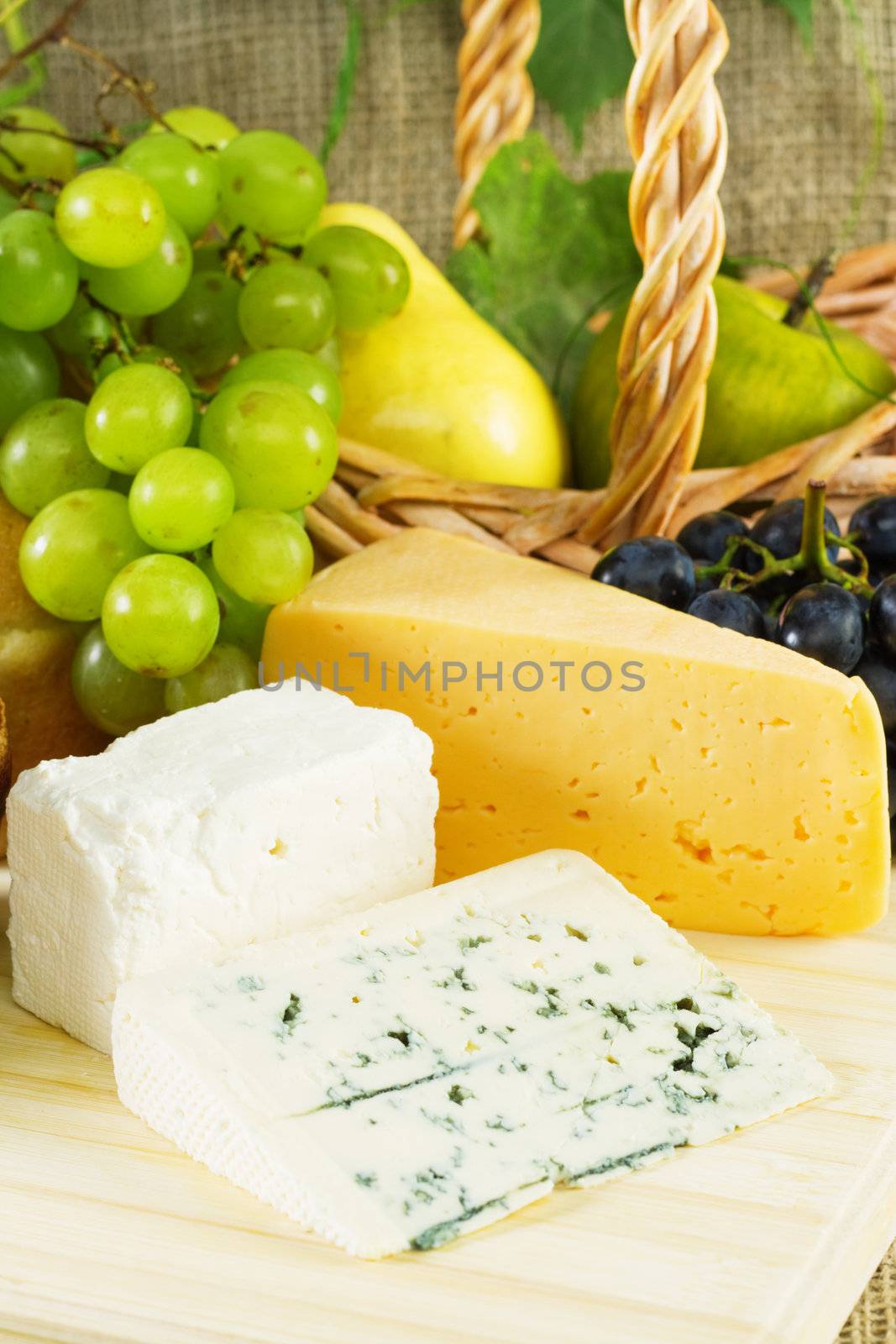 Wine and grapes on vintage background, studio photo