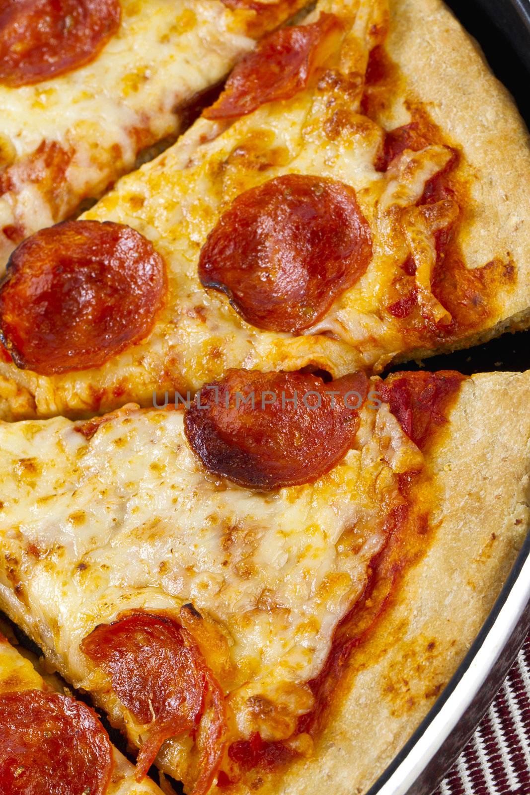 Cropped overhead view of a delicious pizza in a macro image.
