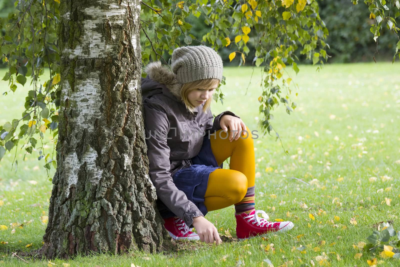 Cute girl in autumn park by miradrozdowski