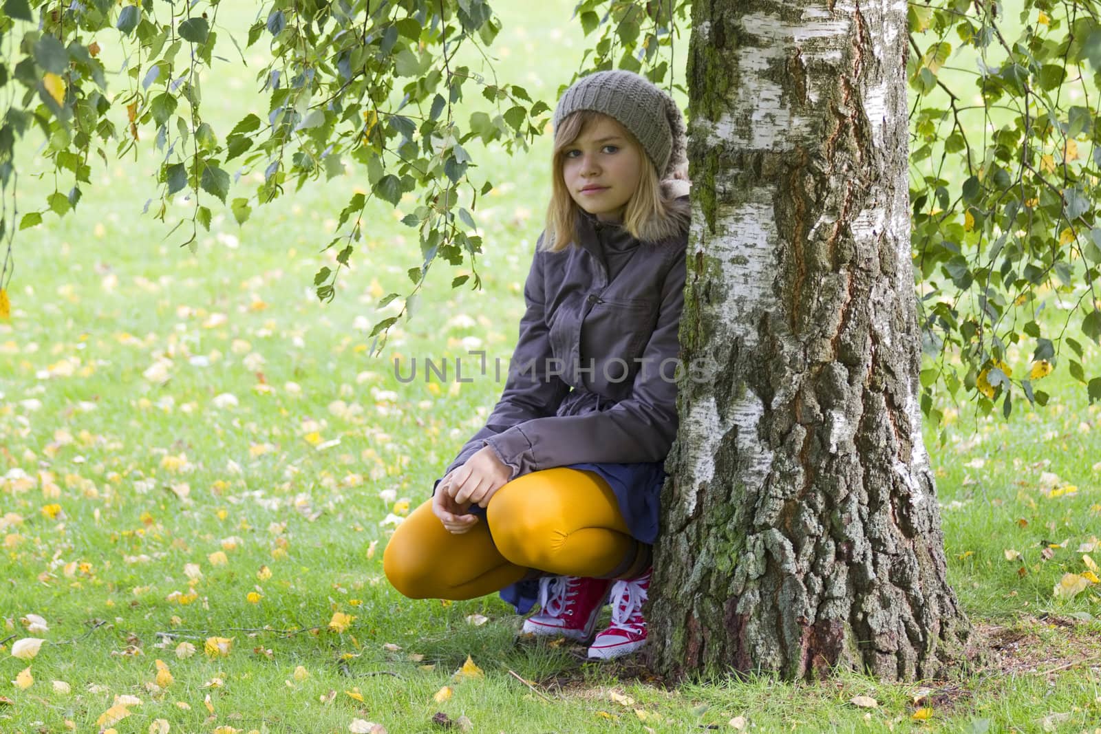 Cute girl in autumn park