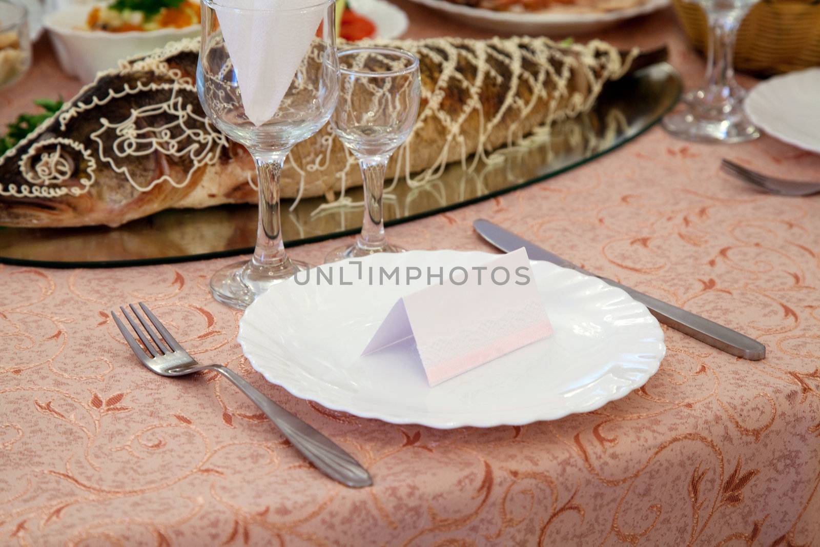 Served table in a restaurant by Gdolgikh