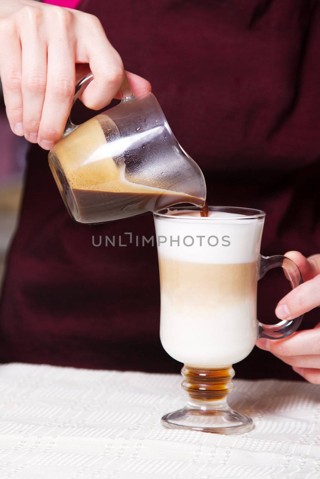 Barista making latte by Gdolgikh