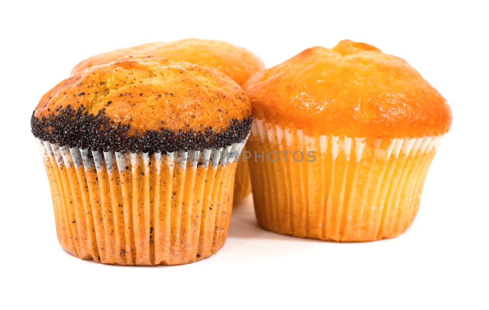 Three tasty muffins with poppies isolated on white background