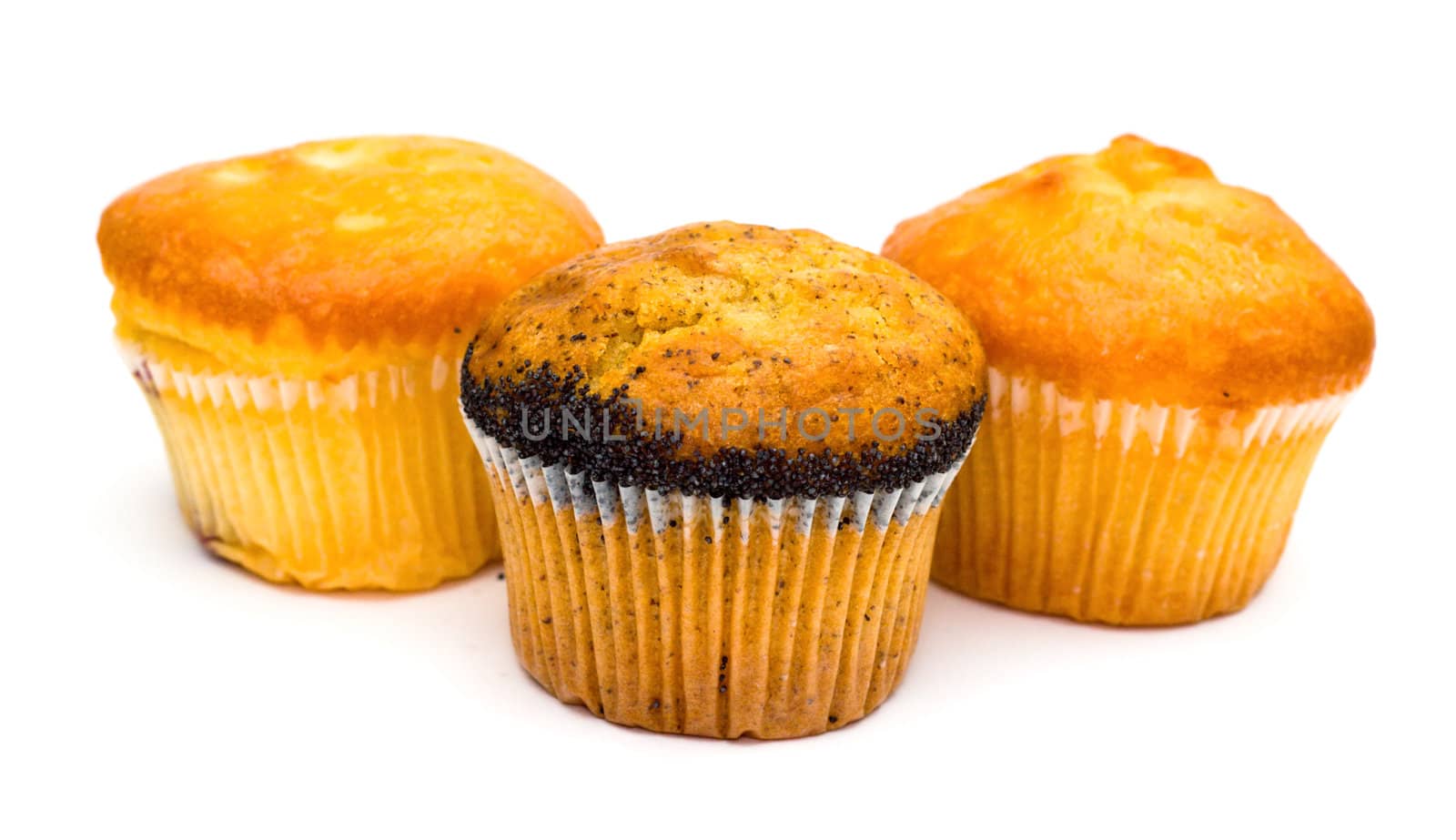 Three muffins isolated on white by Gdolgikh