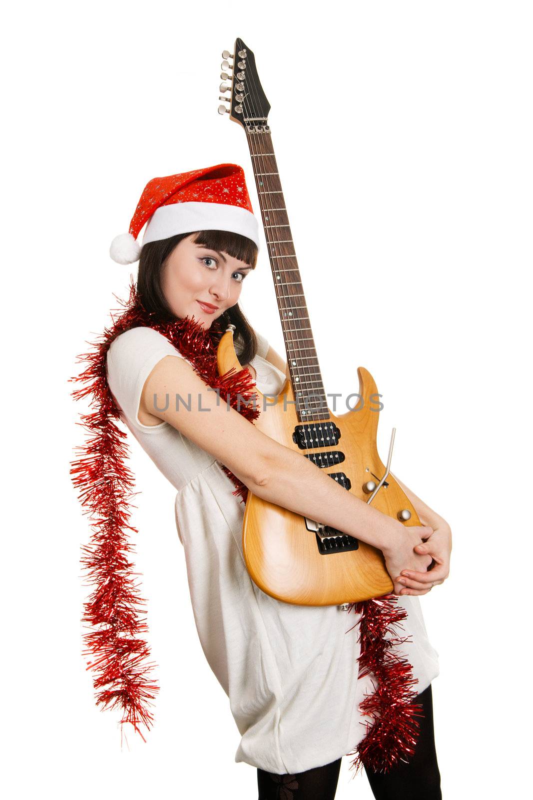 Joyful christmas girl with an electric guitar