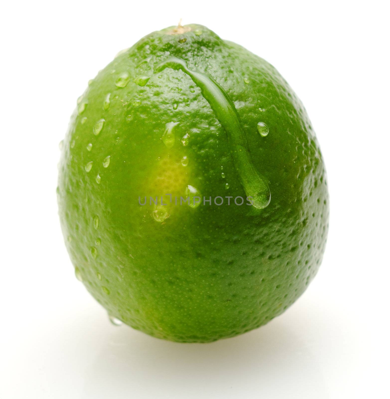 Juicy lime with waterdrops on its surface, isolated on white