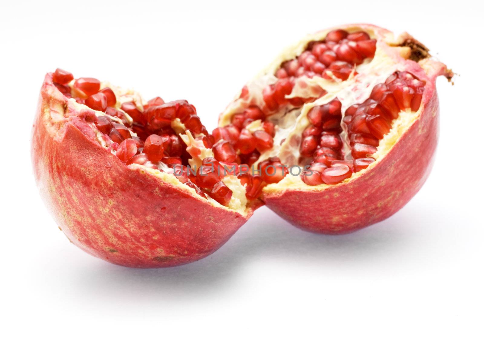 Pomegranate isolated on white background by Gdolgikh