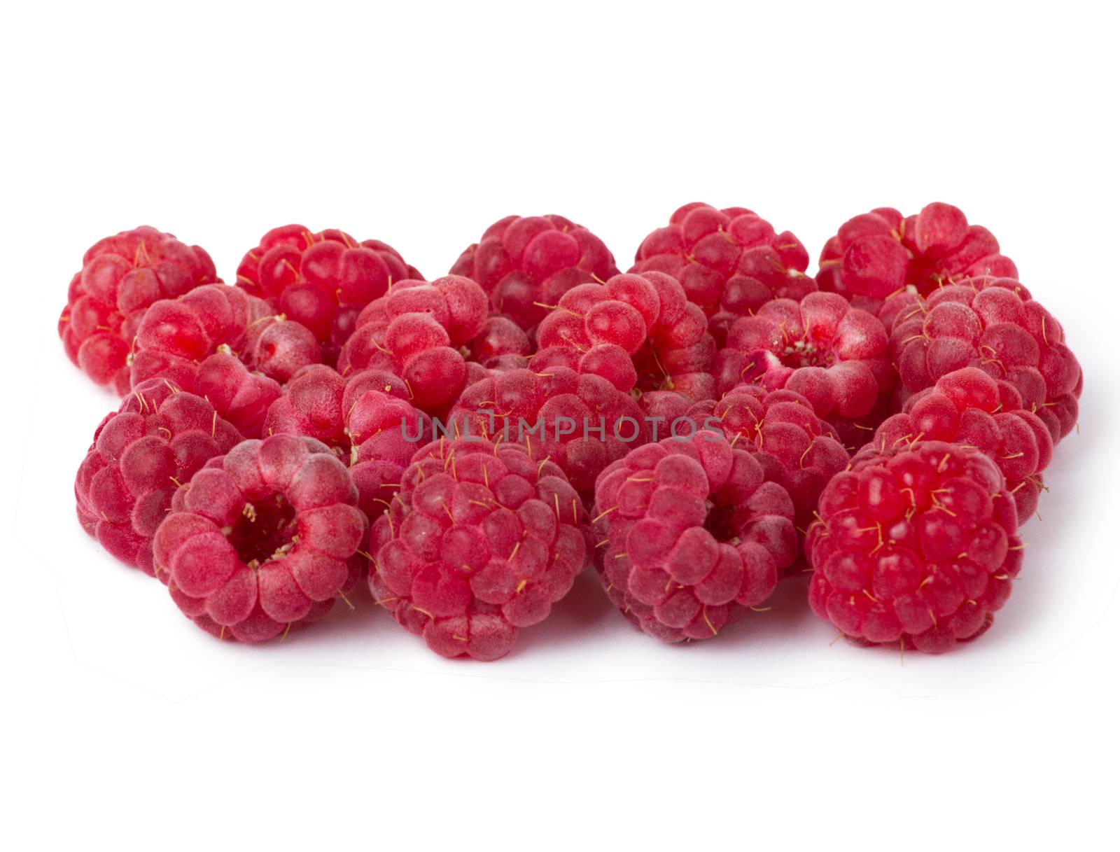 Ripe red raspberries isolated on white background