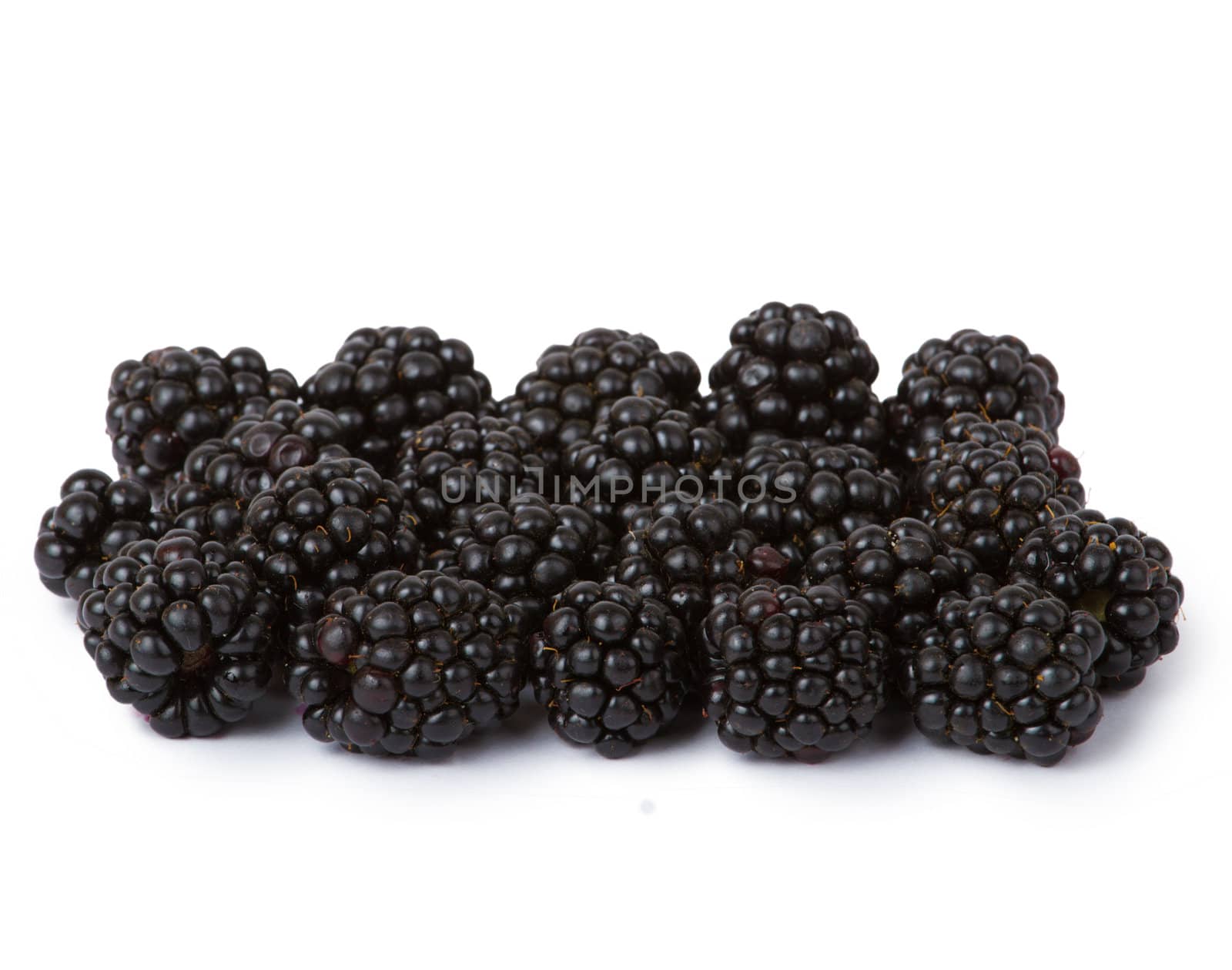 Ripe juicy blackberries isolated on white background