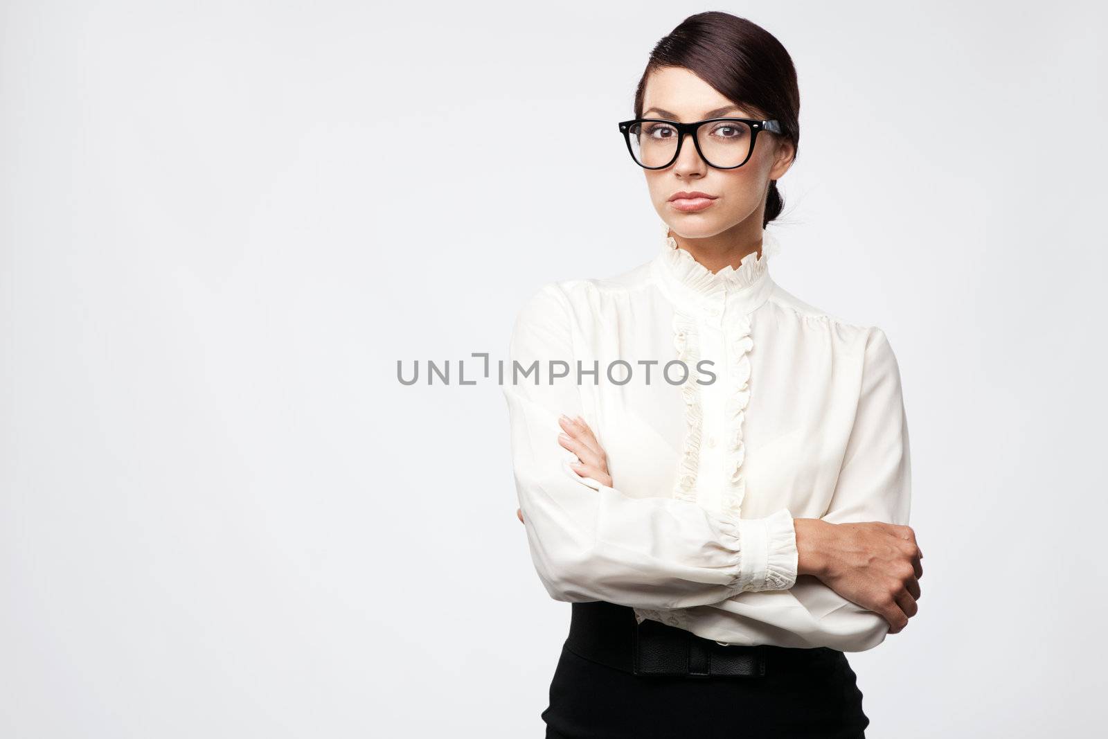 Strict woman in large glasses, isolated on white background