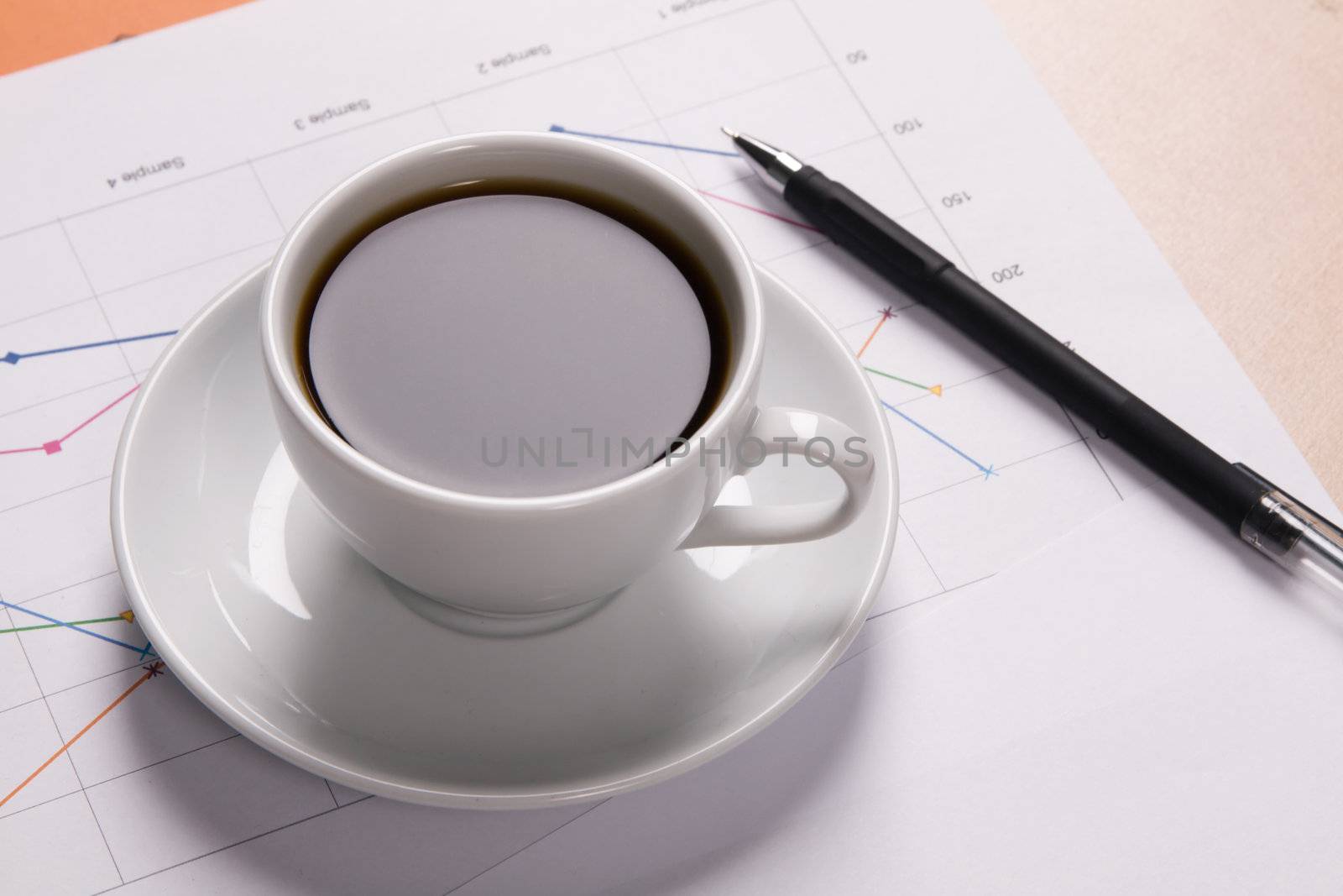 Worktable covered with documents, with a cup of coffee