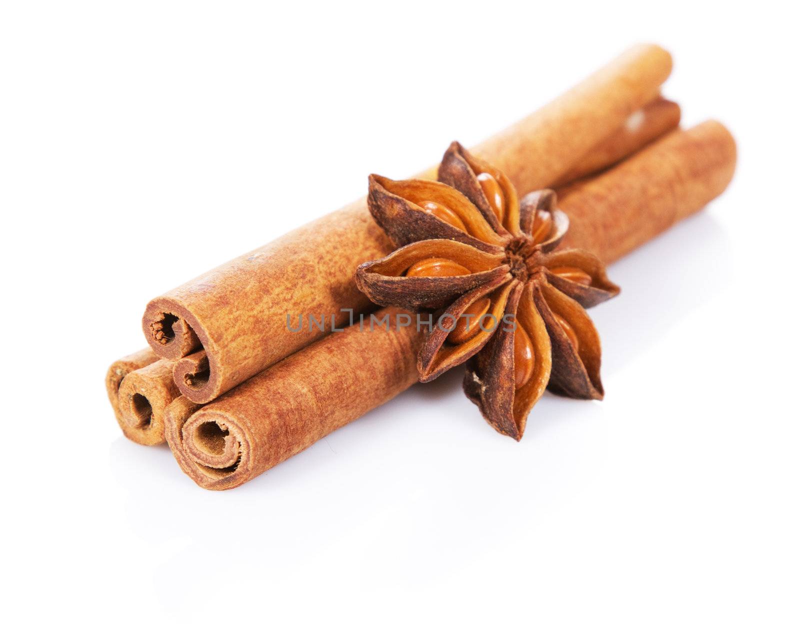 Cinnamon sticks and anisetree isolated on white background