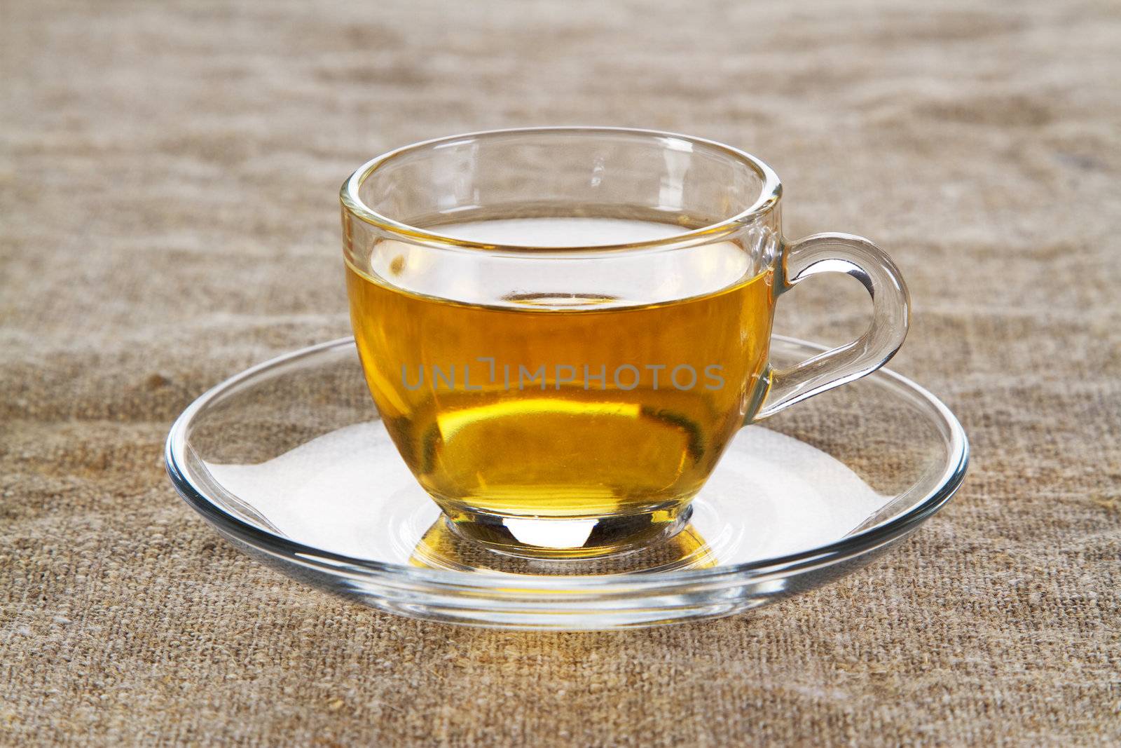 Tea cup with fresh mint leaves, closeup photo