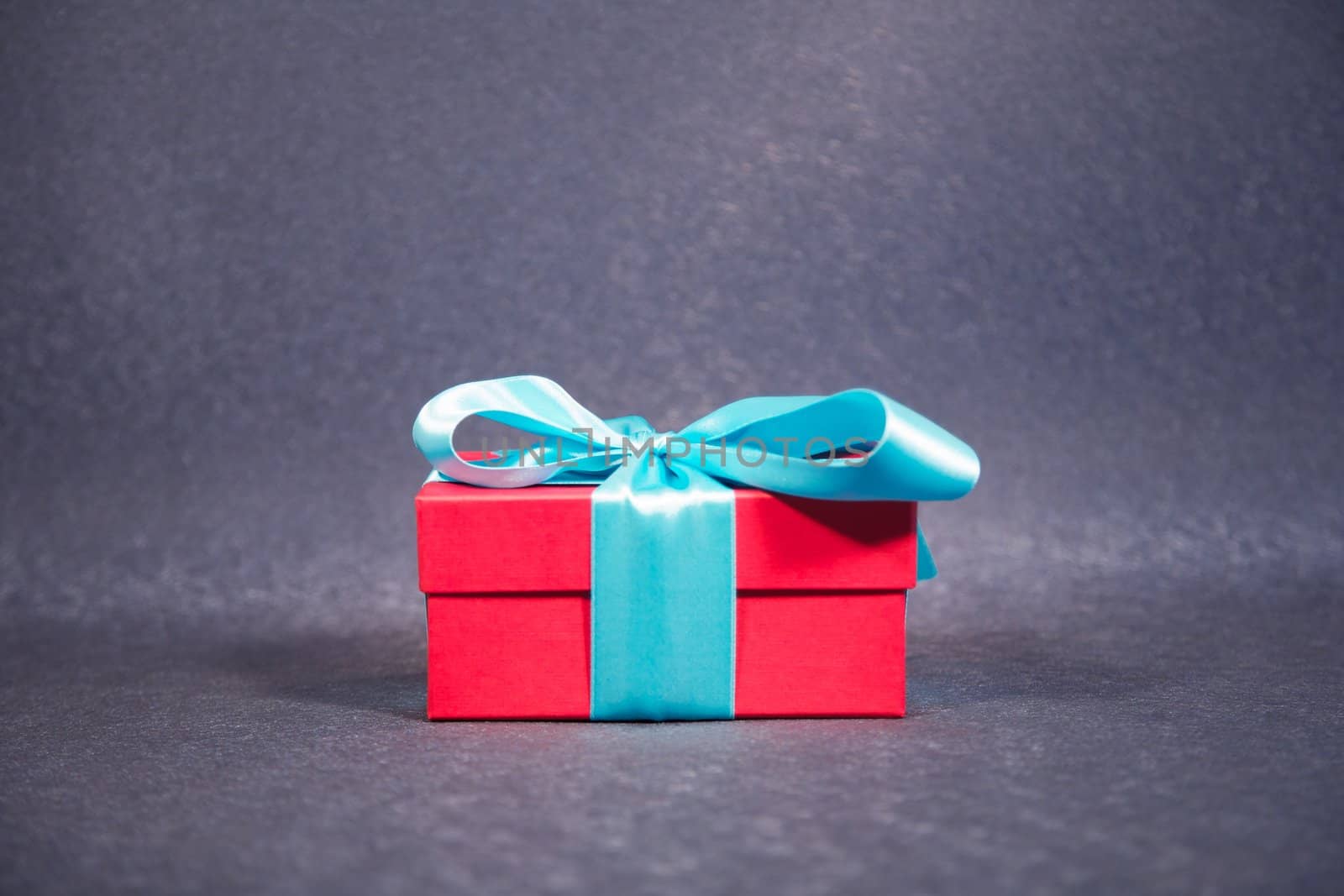 gift box with ribbon and bow at still life