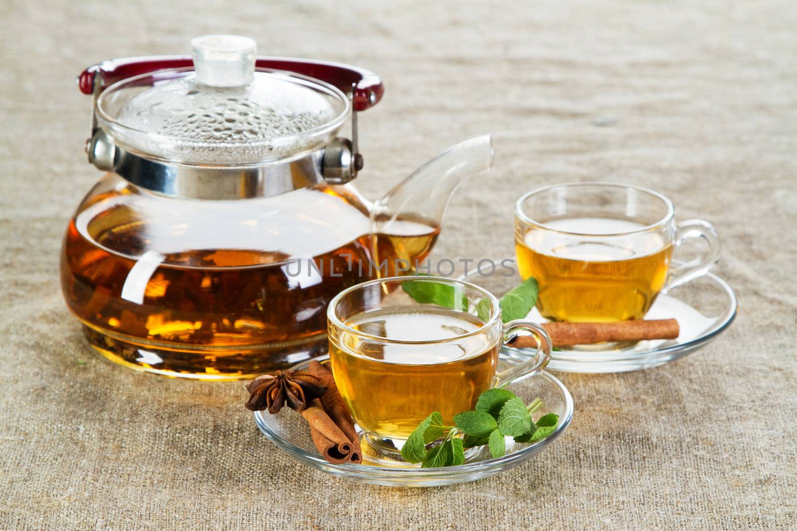 Tea cup with fresh mint leaves, closeup photo