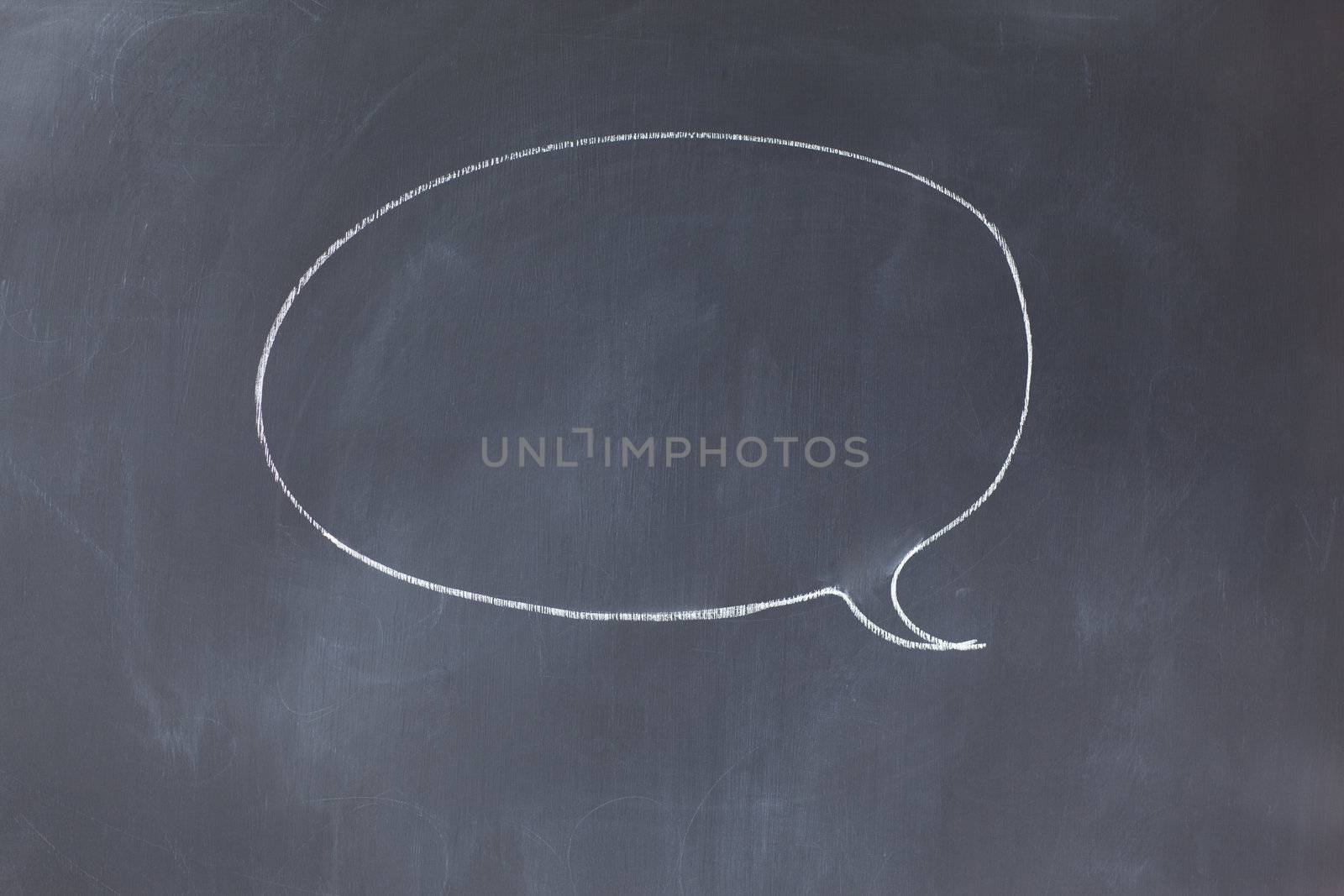 Empty circle comic strips balloon on a blackboard