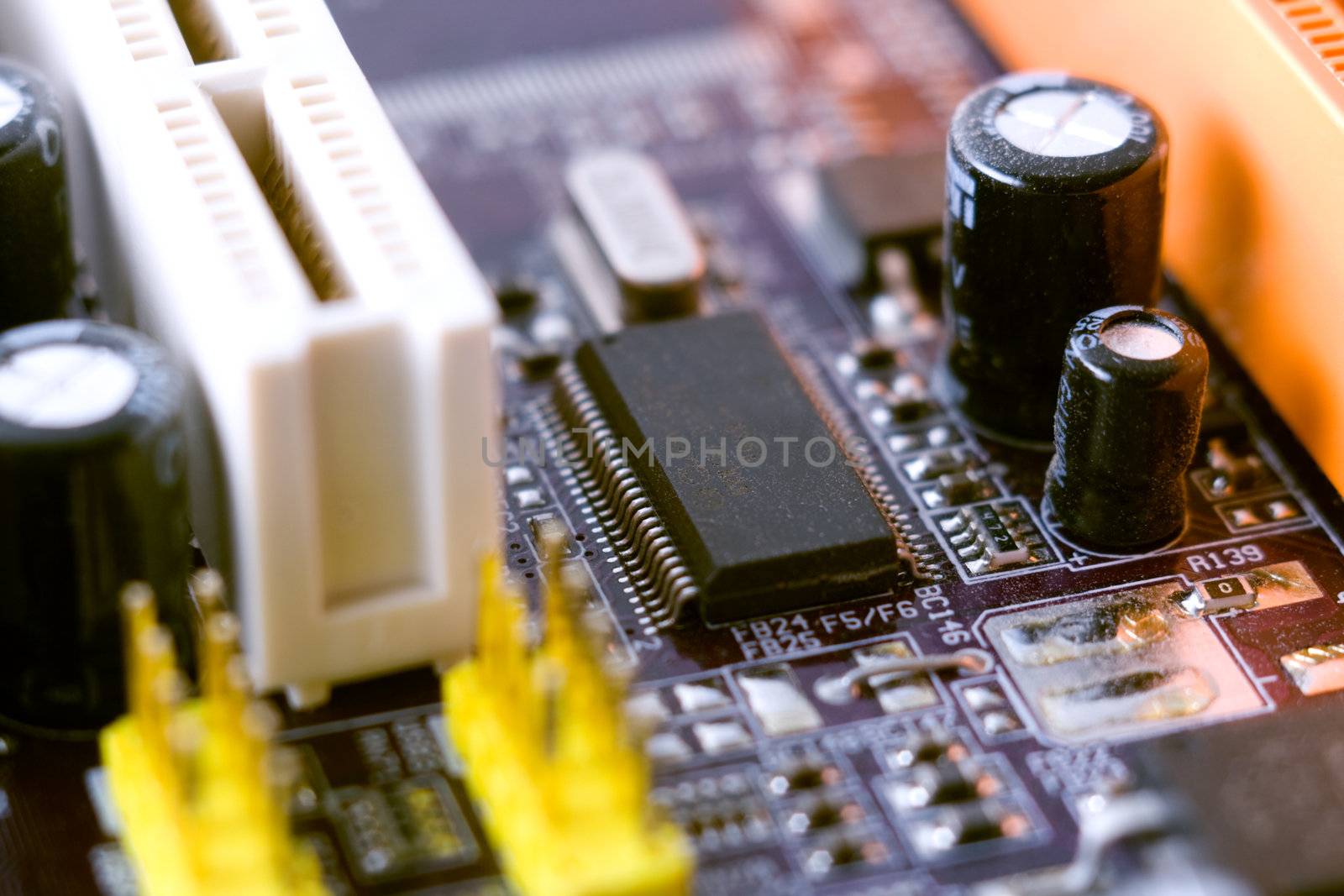 Computer motherboard closeup photo by Gdolgikh