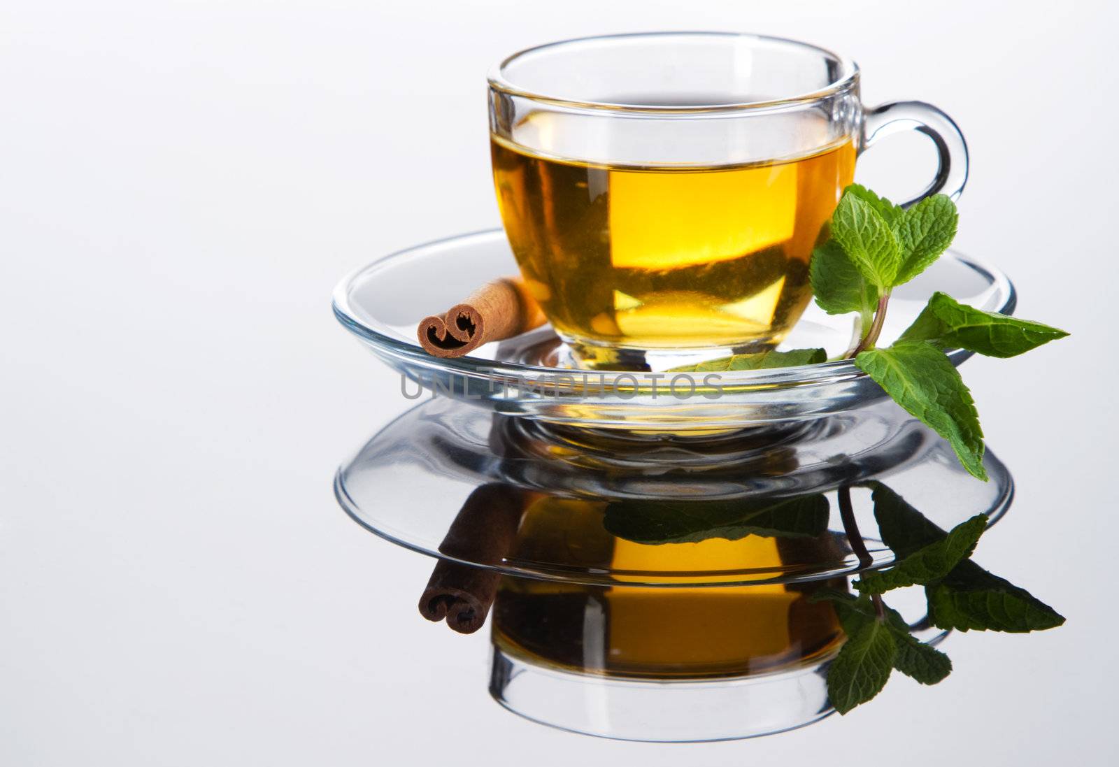 Tea cup with fresh mint leaves, closeup photo