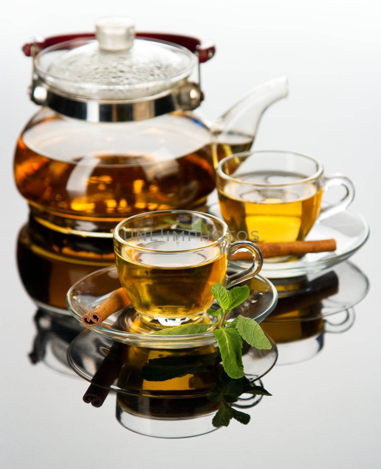 Tea cup with fresh mint leaves, closeup photo