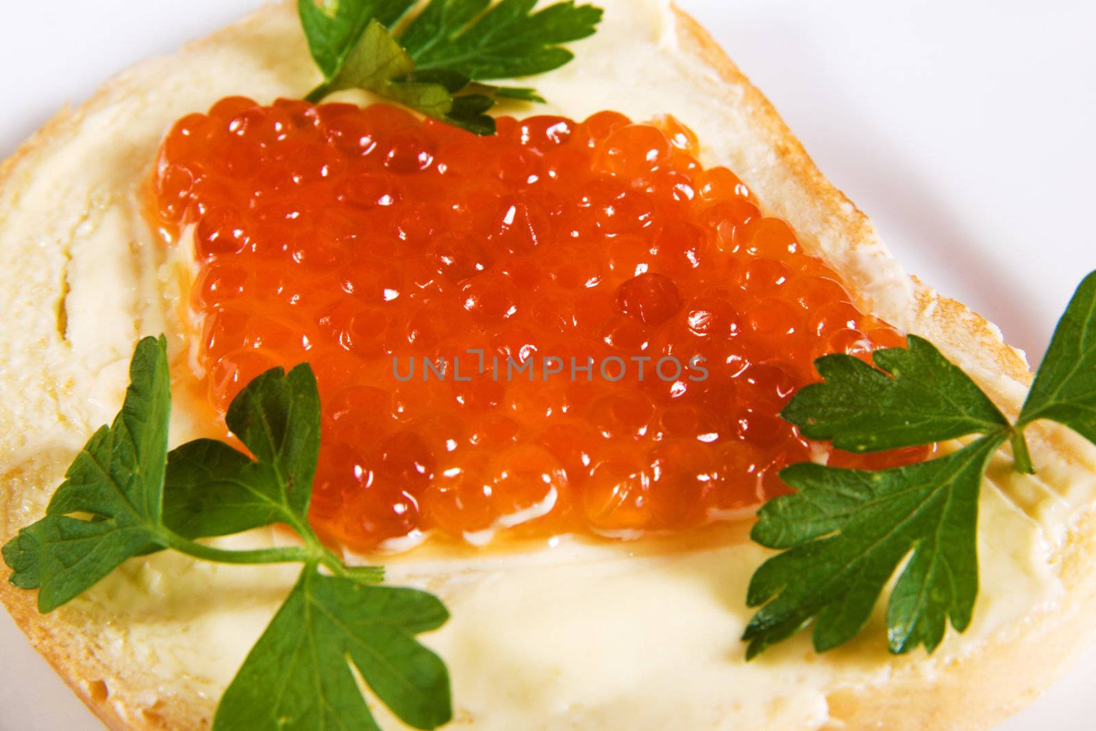 Closeup imagr of red caviar with bread and butter 