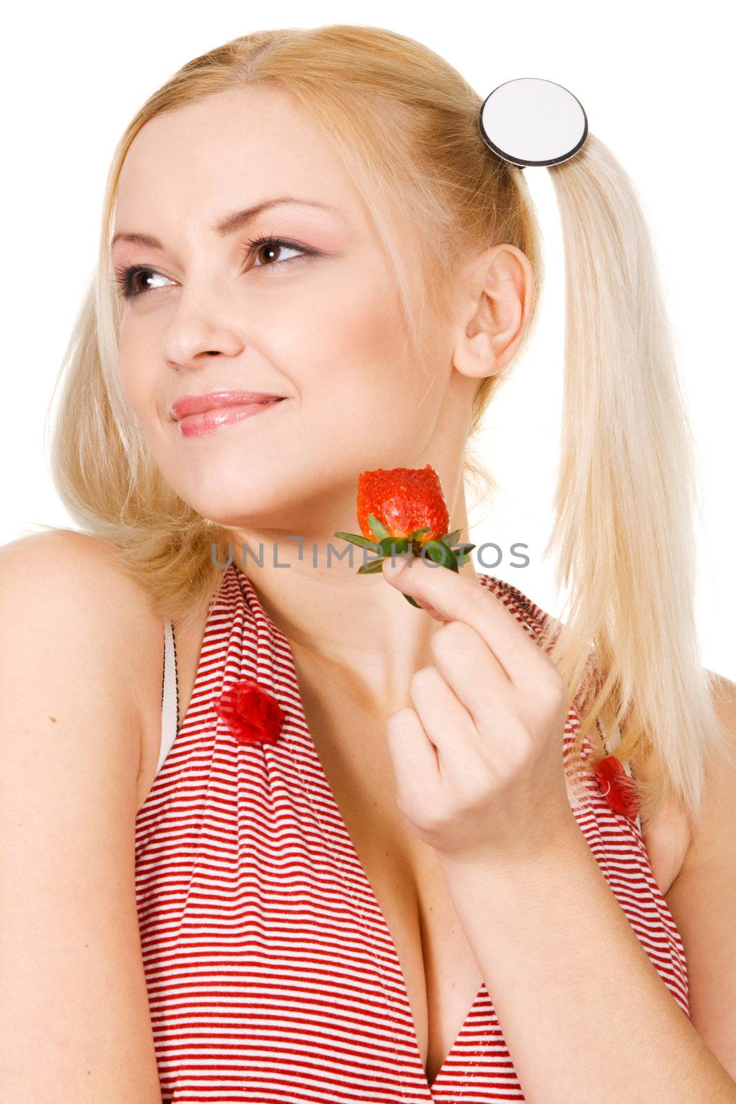 Beautiful girl tasting a strawberry, face portrait