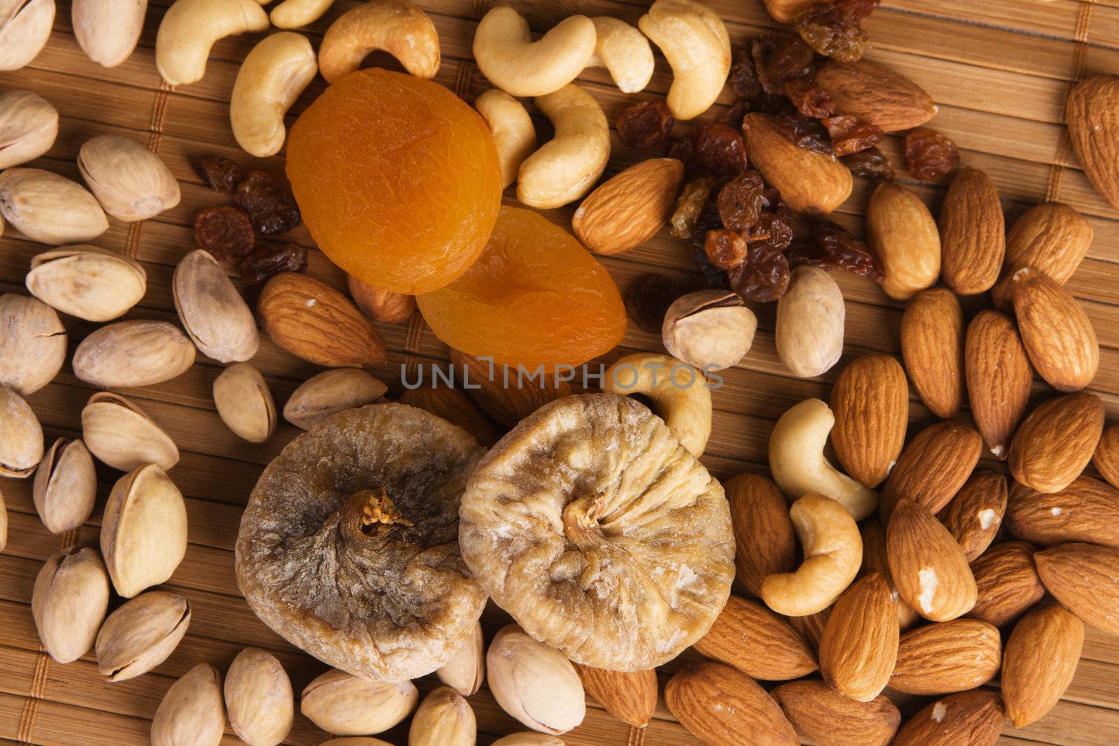 Nuts, fig and dried apricots still life