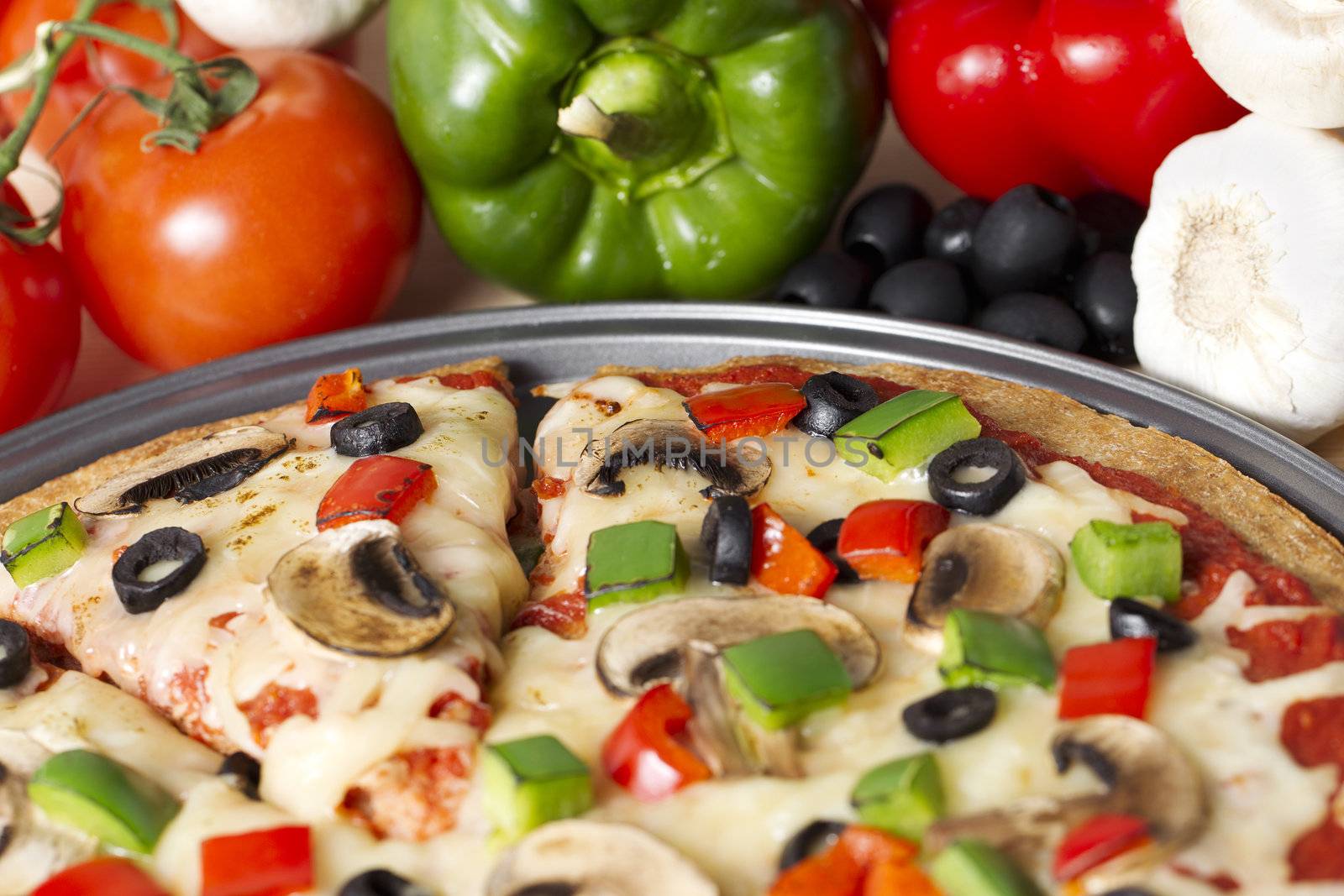 Cropped image of supreme pizza with ingredients