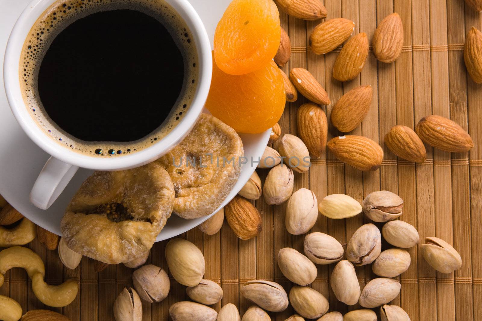 Coffee with nuts, fig and dried apricots by Gdolgikh