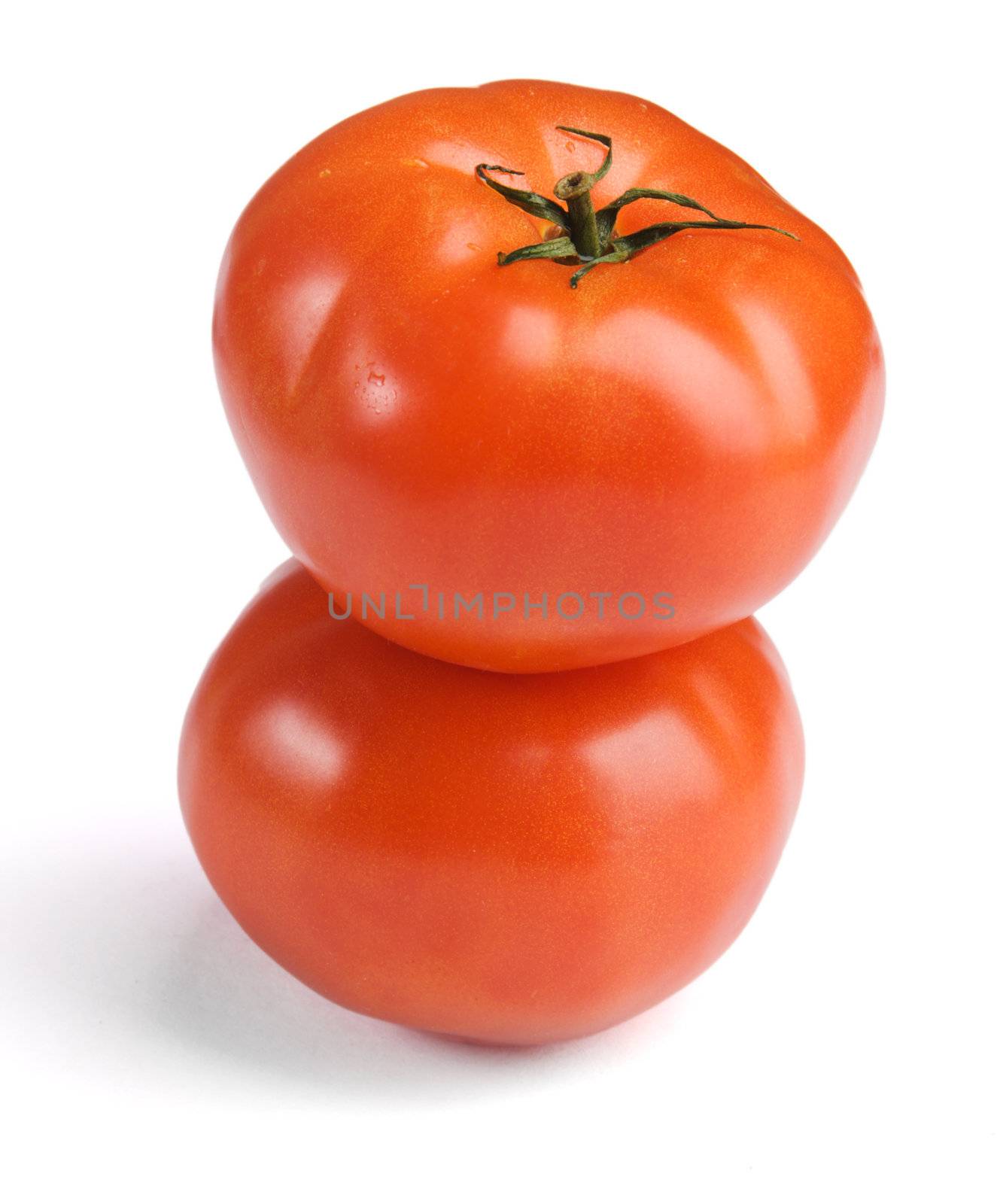 Ripe tomatoes on white background