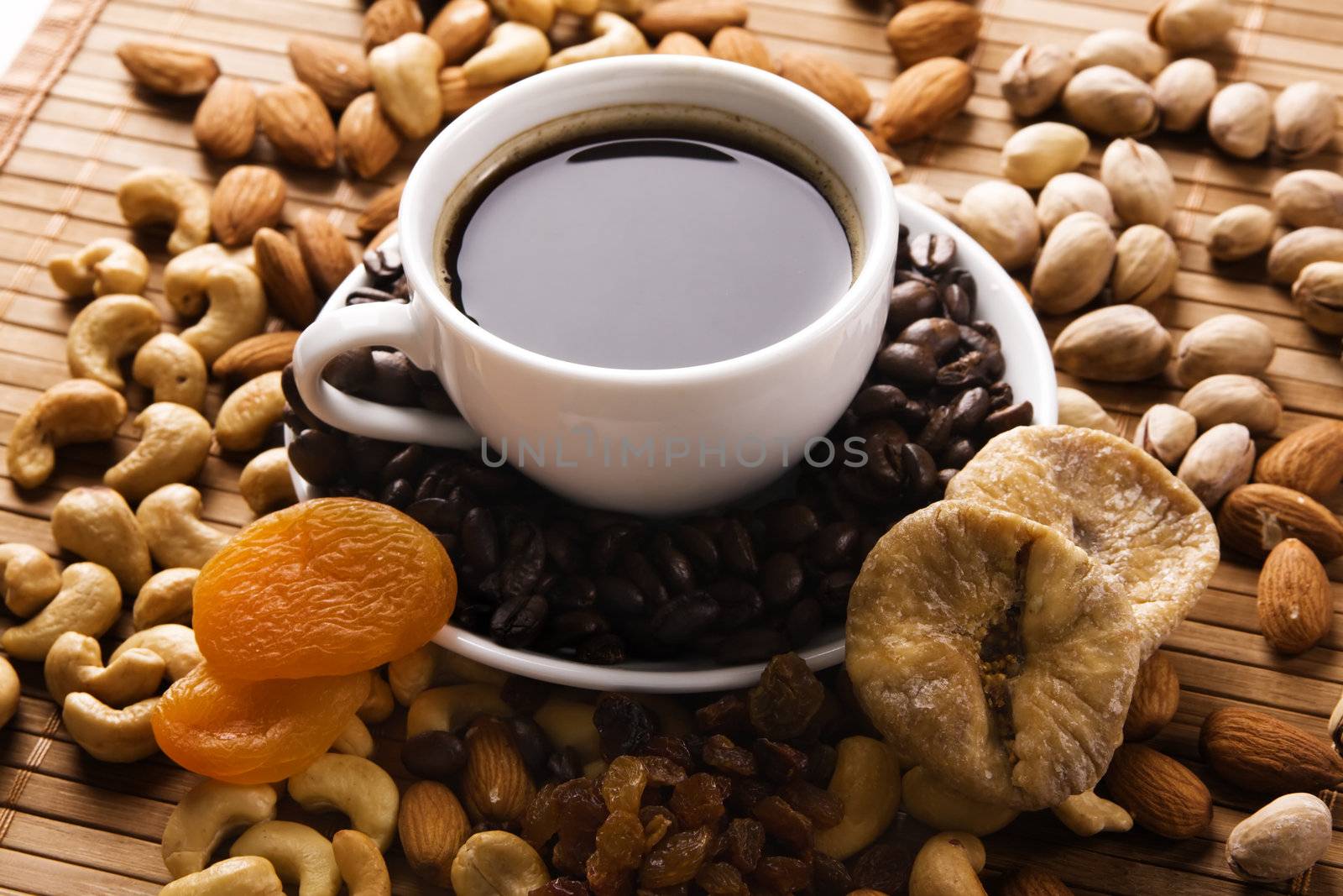 Coffee with nuts, fig and dried apricots still life 