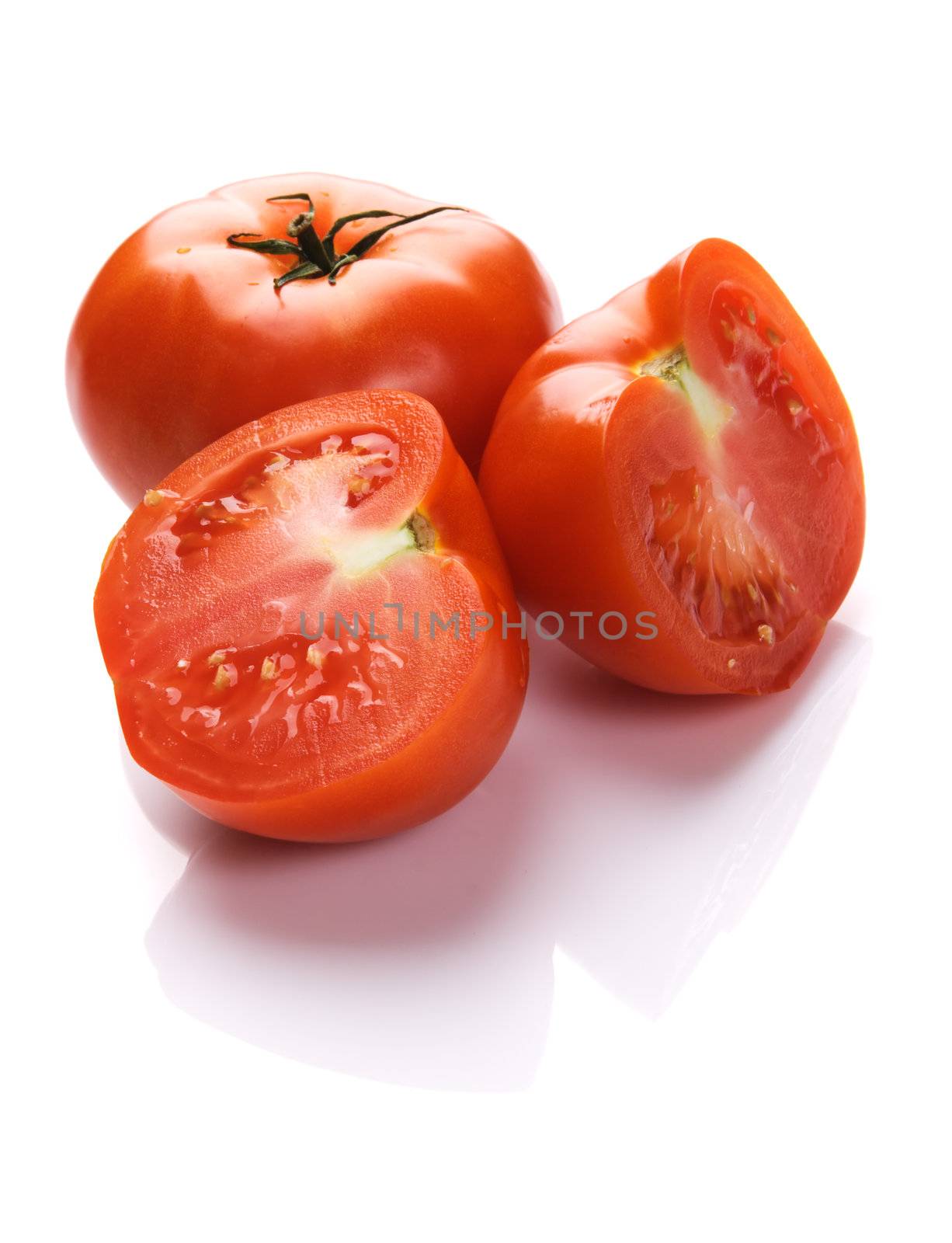 Ripe tomatoes on white background