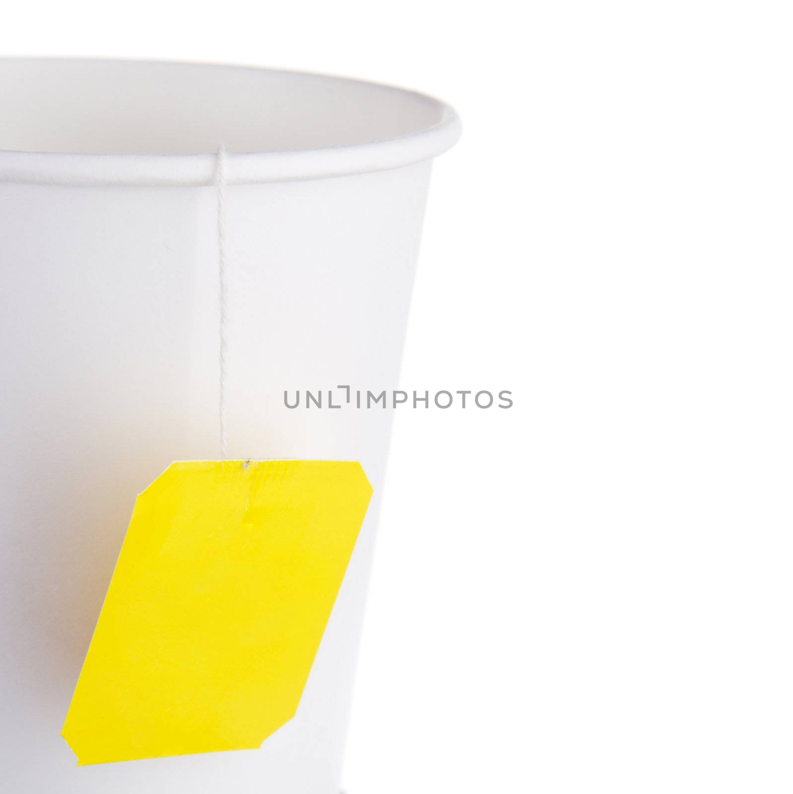 Paper cup of tea against white background