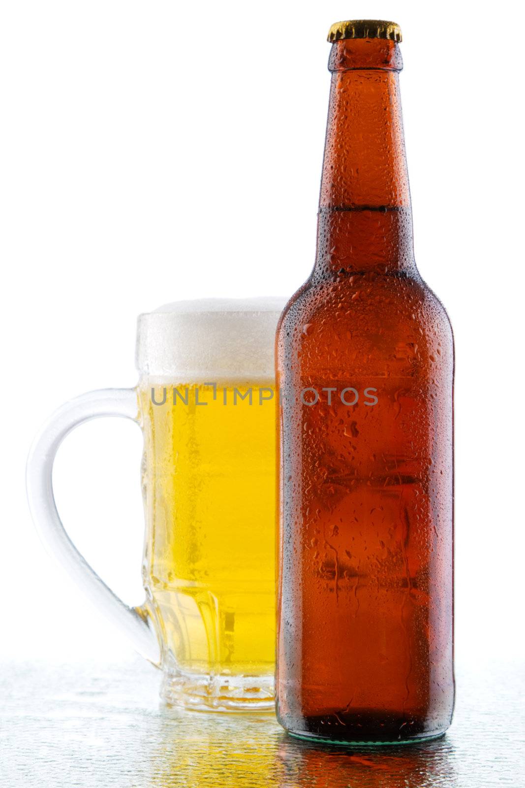 Beer mug and bottle isolated on white background, studio photo