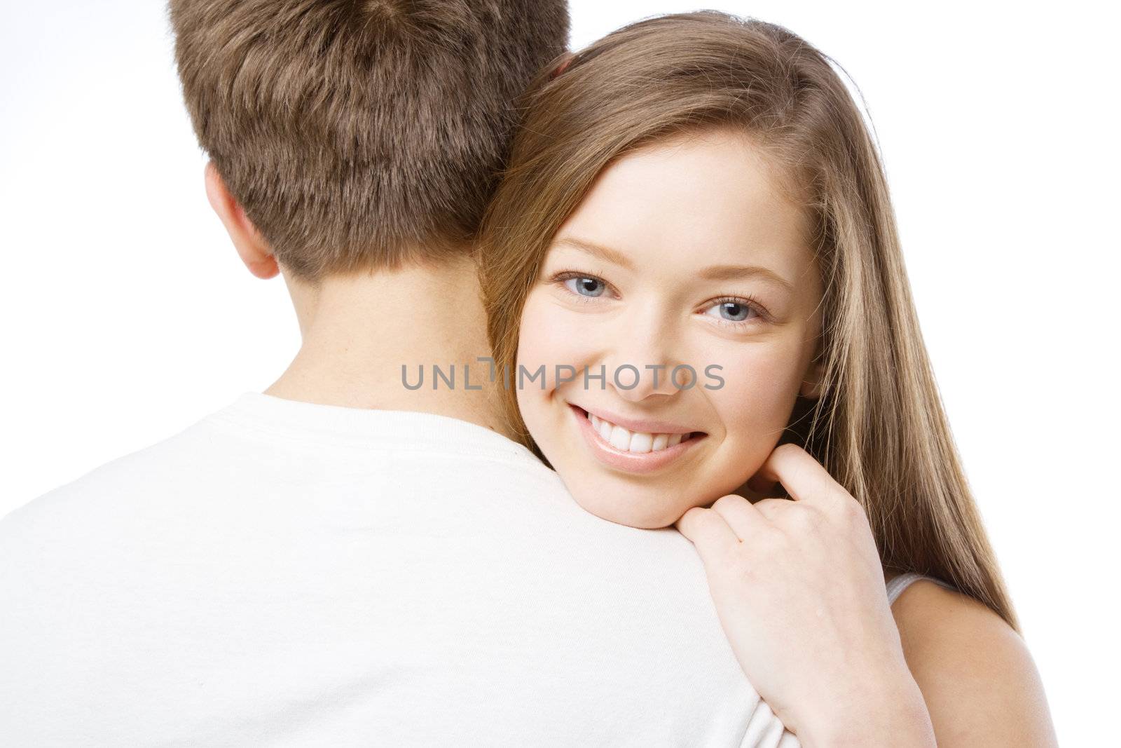 Beautiful girl leaning on boyfriend's shoulder, white background